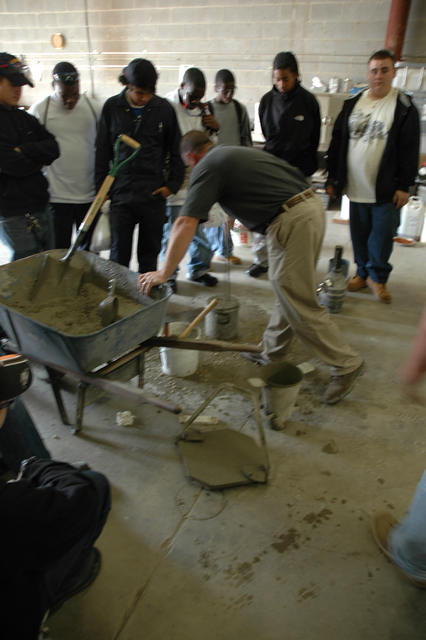 Mike Hockenberry shows students how to test concrete.